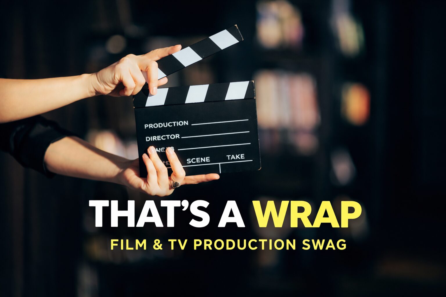 Person holding a film clapperboard with text about film and TV production swag.